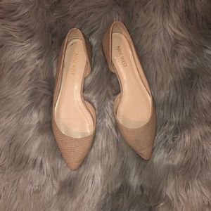 Nude pointed flats.